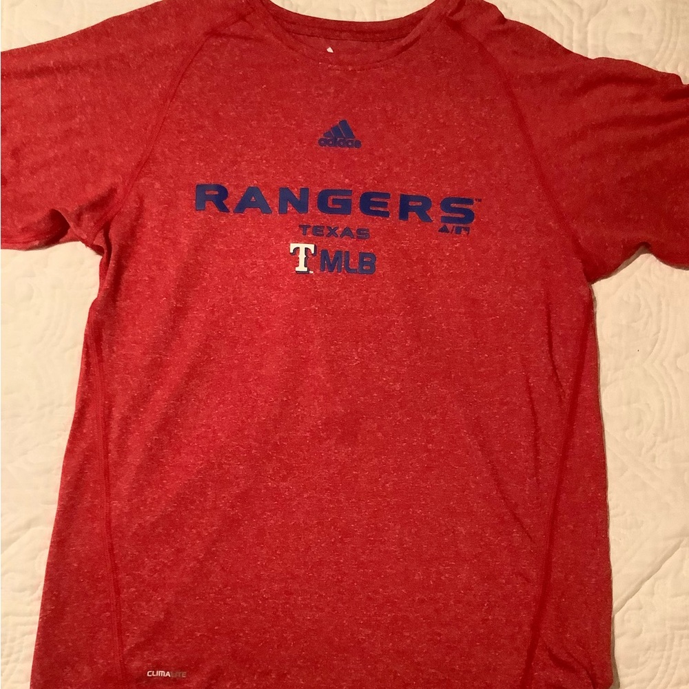 This is a youth size (L) t-shirt. It is made of 100% polyester and fits a youth.